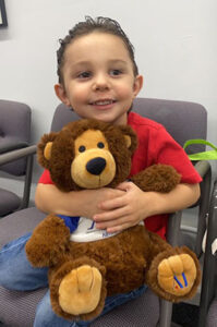 BBP-CHILD-HOLDING-BEAR-med-cropped